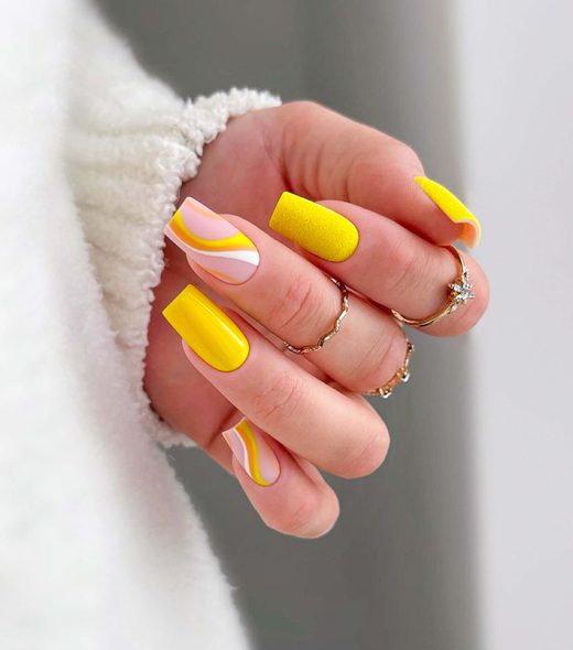 Simple and modern long square yellow nails with wavy designs, wearing a ring. Basic nails. Gel manicures. Acrylic nails. Wedding manicure